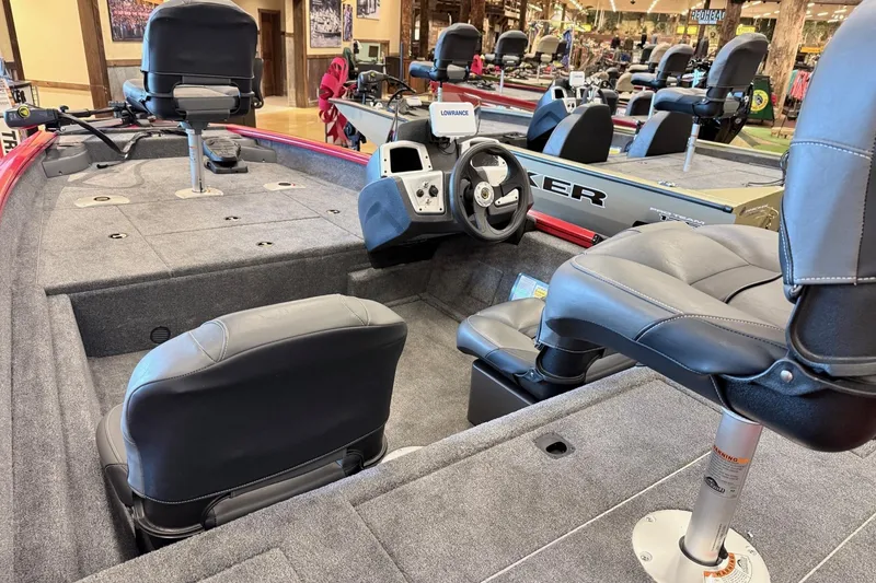 Slide: The Image of 2026 Tracker Pro Team 175 Crappie Edition boat interior with seating and steering console. - 6