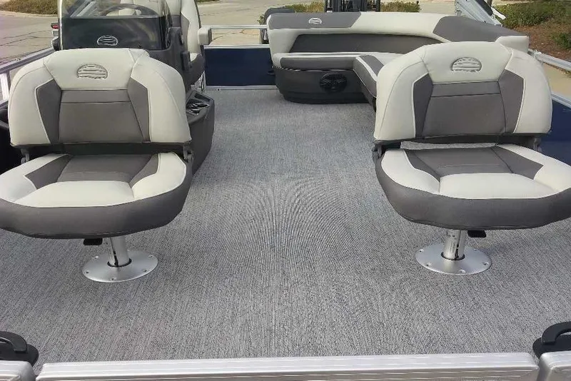 Slide: The Image of 2026 Sun Tracker Bass Buggy 16 XL Select interior with gray seating and carpeted floor. - 10