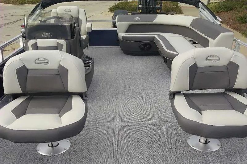 Slide: The Image of 2026 Sun Tracker Bass Buggy 16 XL Select interior with gray seating and carpeted floor. - 9