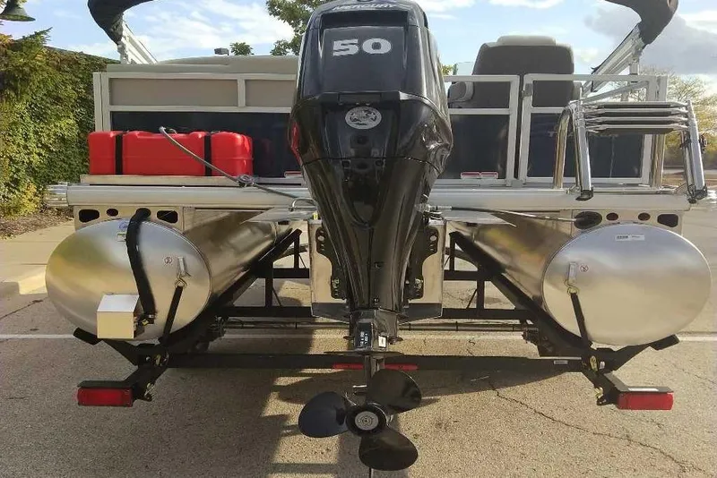 Slide: The Image of 2026 Sun Tracker Bass Buggy 16 XL Select pontoon boat with outboard motor and fuel tanks. - 5