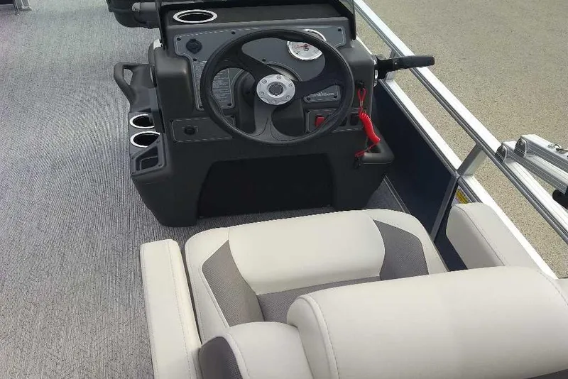 Slide: The Image of Interior view of 2026 Sun Tracker Bass Buggy 16 XL Select boat cockpit. - 4