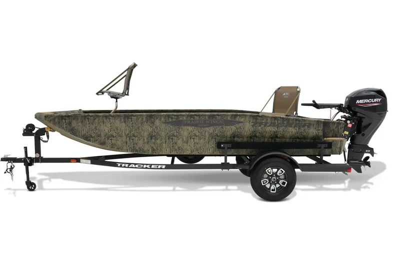 Slide: The Image of 2026 Tracker Grizzly 1650 T Prairie Wings Edition boat with Mercury engine on trailer. - 2