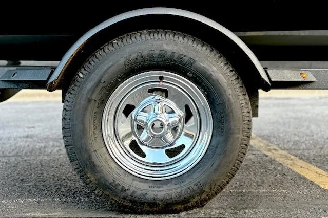 Slide: The Image of 2026 Tracker Pro Team 175 Crappie Edition boat interior with three cushioned seats. - 16