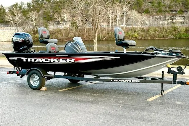 Slide: The Image of 2026 Tracker Pro Team 175 Crappie Edition boat parked by a river. - 25