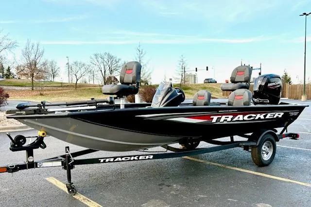 Slide: The Image of 2026 Tracker Pro Team 175 Crappie Edition boat dashboard with steering wheel and electronic displays. - 31