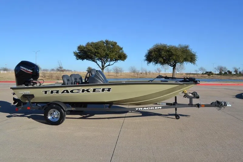 Slide: The Image of 2026 Tracker Pro Team 175 Crappie Edition boat on trailer, parked outdoors. - 6