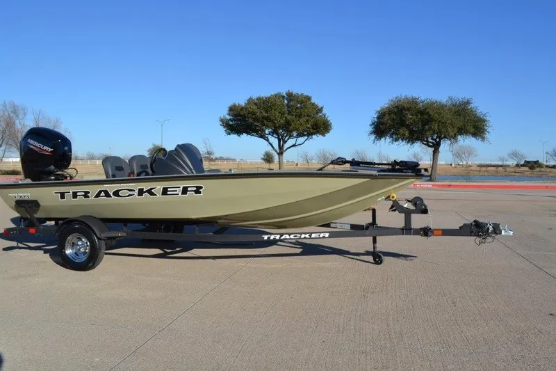 Slide: The Image of 2026 Tracker Pro Team 175 Crappie Edition boat on trailer, parked outdoors. - 7