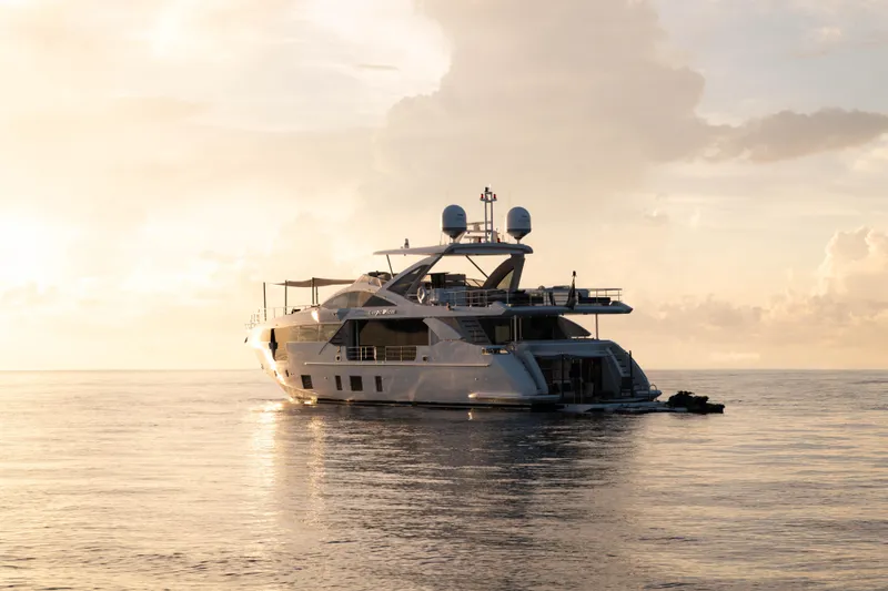 Slide: The Image of Luxurious 2023 Azimut yacht cruising at sunset on calm ocean waters. - 14
