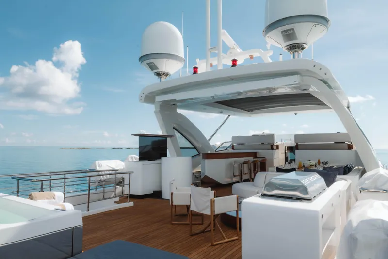 Slide: The Image of Luxurious 2023 Azimut yacht deck with seating, dining area, and ocean view. - 27