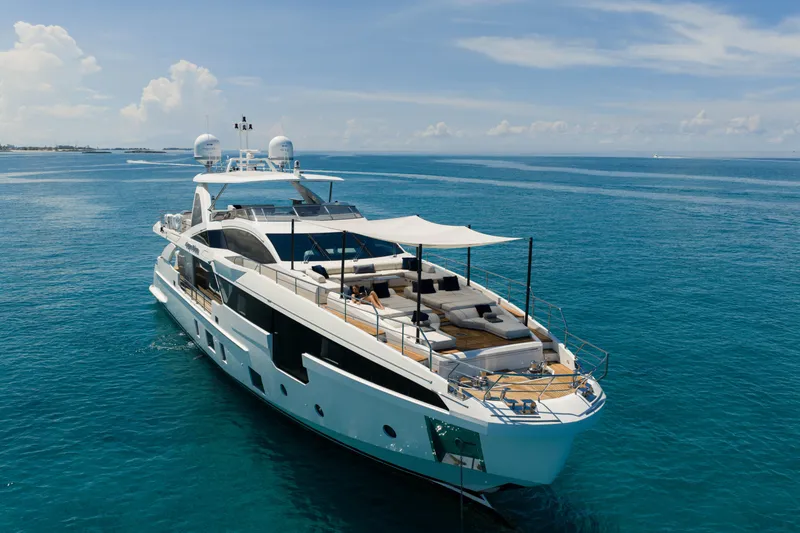 Slide: The Image of Luxurious 2023 Azimut yacht cruising on clear blue ocean waters. - 4