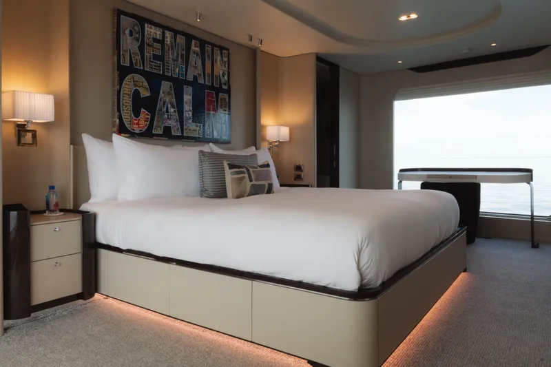 Slide: The Image of Luxurious Azimut yacht bedroom with modern decor, large bed, and ocean view. - 41