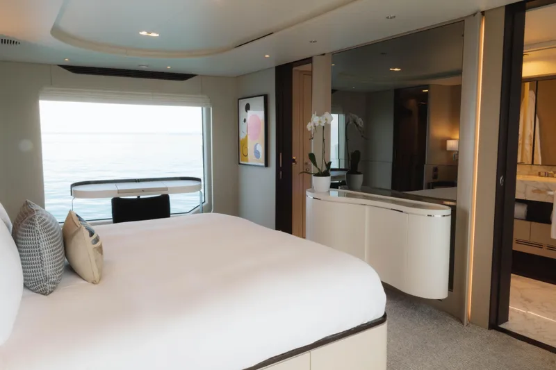 Slide: The Image of Luxurious 2023 Azimut yacht bedroom with ocean view, modern decor, and elegant furnishings. - 42
