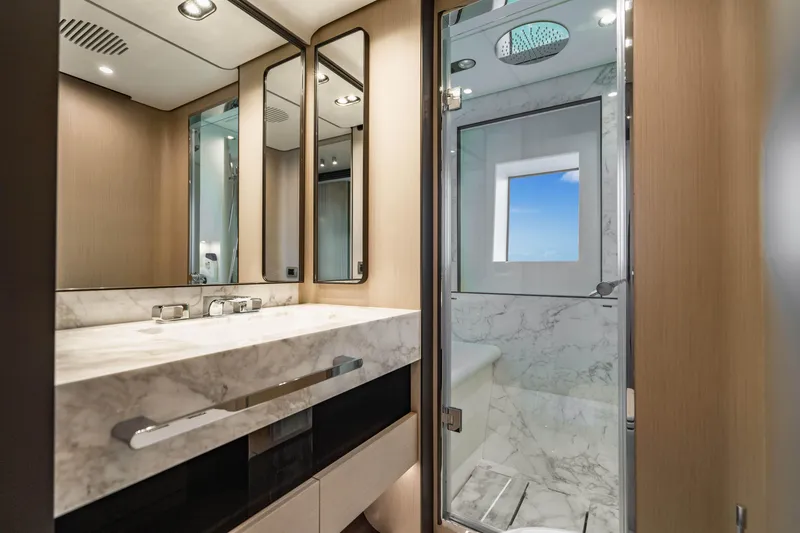 Slide: The Image of Luxurious 2023 Azimut yacht bathroom with marble sink and modern shower. - 48