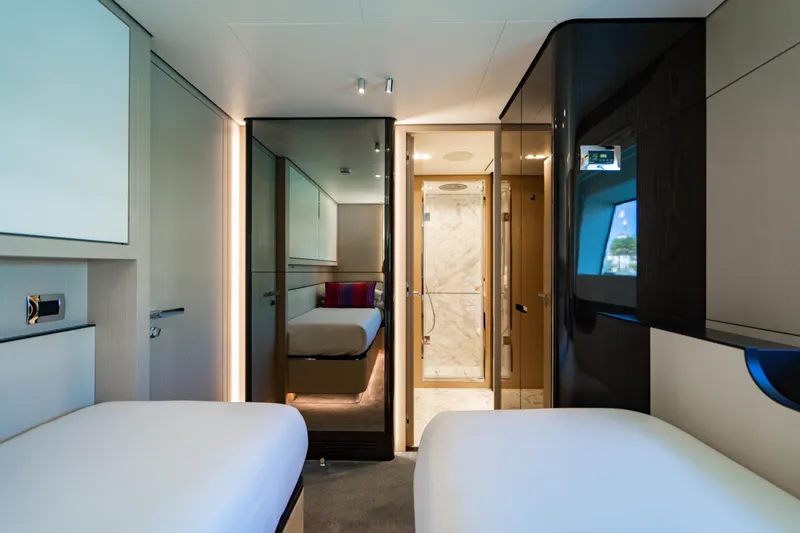 Slide: The Image of Luxurious 2023 Azimut yacht interior with twin beds and modern bathroom. - 49