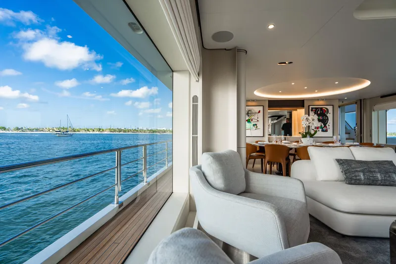 Slide: The Image of Luxurious 2023 Azimut yacht interior with ocean view, modern decor, and elegant dining area. - 52
