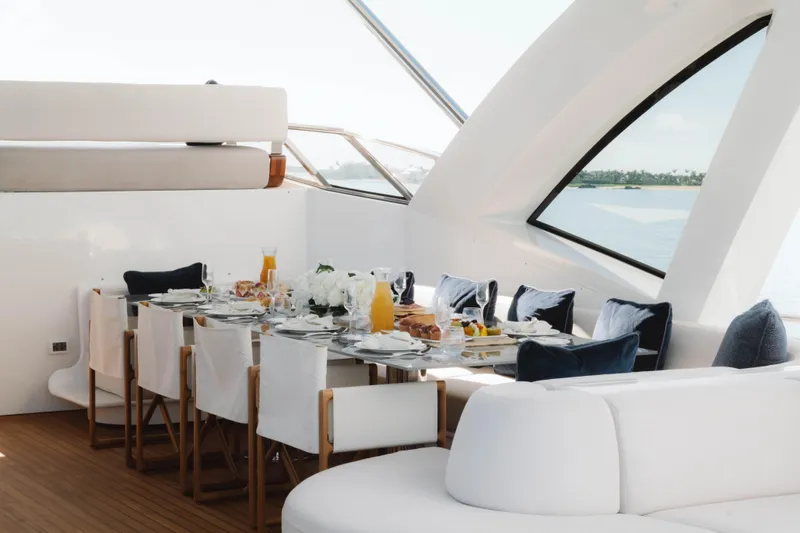 Slide: The Image of Luxurious dining setup on a 2023 Azimut yacht with ocean view. - 65