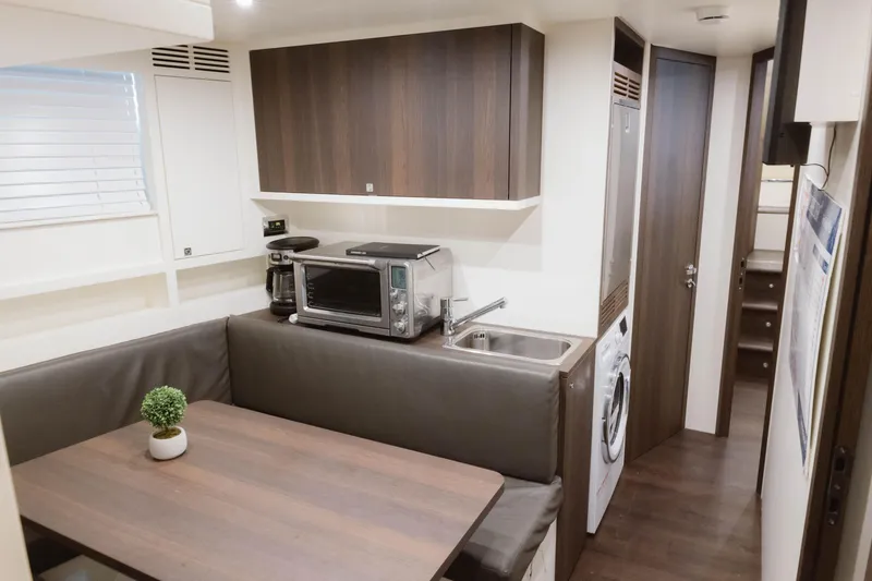 Slide: The Image of Luxurious interior of 2023 Azimut 32M Grande yacht with modern kitchen and dining area. - 72