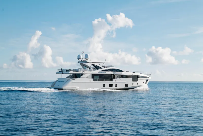 Slide: The Image of Luxury 2023 Azimut yacht cruising on open sea under clear blue sky. - 8