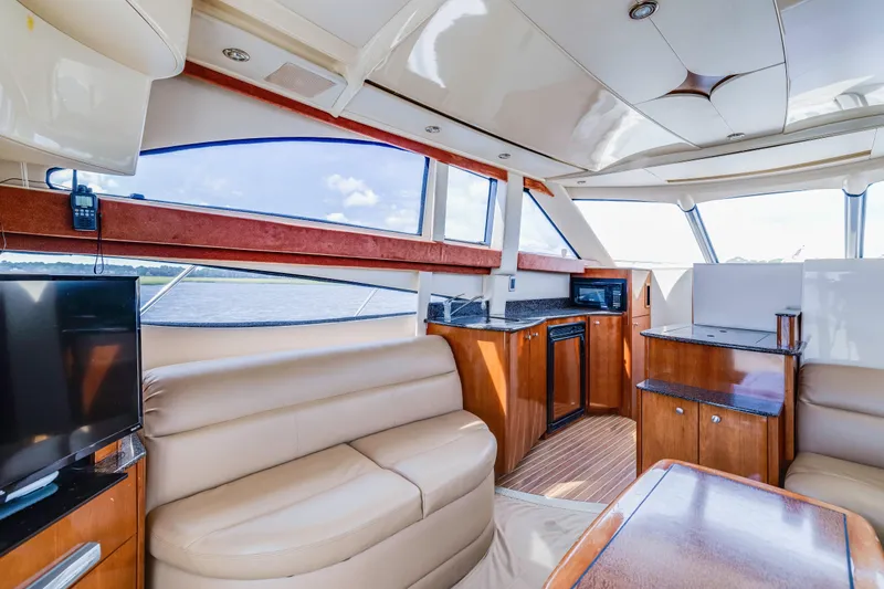 Slide: The Image of Luxurious interior of a 2006 Meridian 341 Sedan yacht with leather seating and modern amenities. - 11