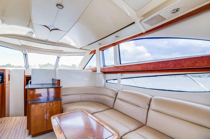Slide: The Image of Luxurious interior of 2006 Meridian 341 Sedan yacht with leather seating and panoramic windows. - 12