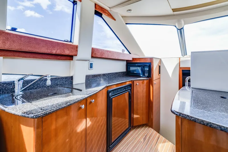 Slide: The Image of Luxurious 2006 Meridian 341 Sedan yacht interior with modern kitchen amenities. - 14