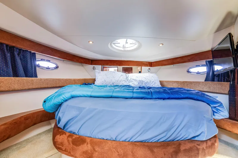 Slide: The Image of Luxurious interior cabin of 2006 Meridian 341 Sedan yacht with cozy bedding. - 20