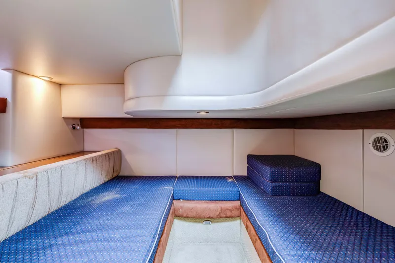 Slide: The Image of Interior cabin of 2006 Meridian 341 Sedan with blue cushioned seating. - 23