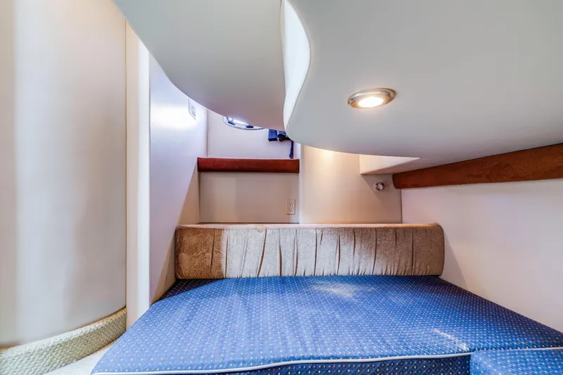 Slide: The Image of 2006 Meridian 341 Sedan interior cabin with blue cushioned seating and overhead lighting. - 24