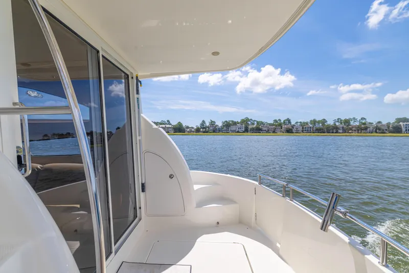 Slide: The Image of 2006 Meridian 341 Sedan yacht deck with scenic waterfront view. - 28