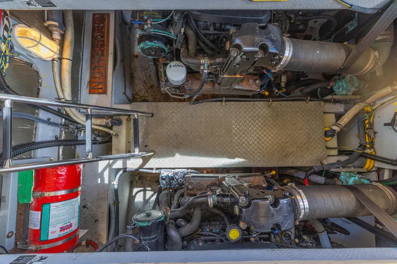 Slide: The Image of Engine room of a 2006 Meridian 341 Sedan with visible machinery and fire extinguisher. - 46