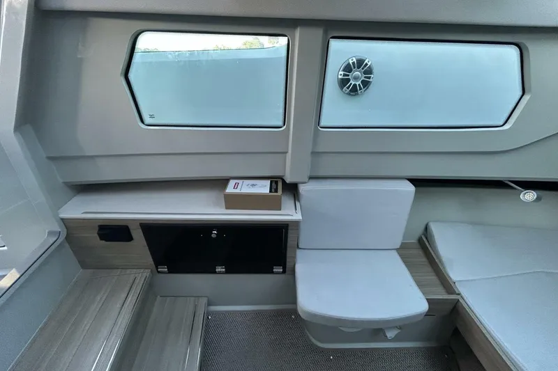 Slide: The Image of Interior of 2022 Saxdor 320 GTO boat, featuring seating and storage compartments. - 10