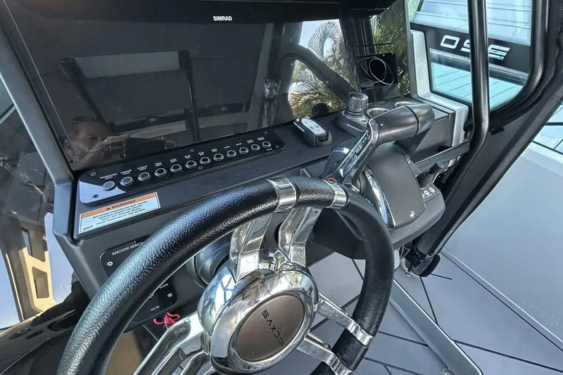 Slide: The Image of Steering console of 2022 Saxdor 320 GTO with modern controls and Simrad display. - 8