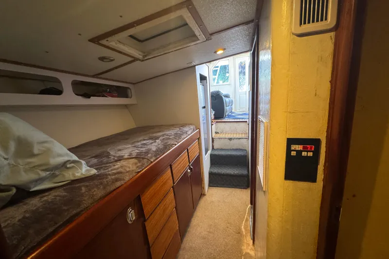 Slide: The Image of Interior of 1965 Hatteras 41 Convertible yacht with cozy sleeping quarters. - 16