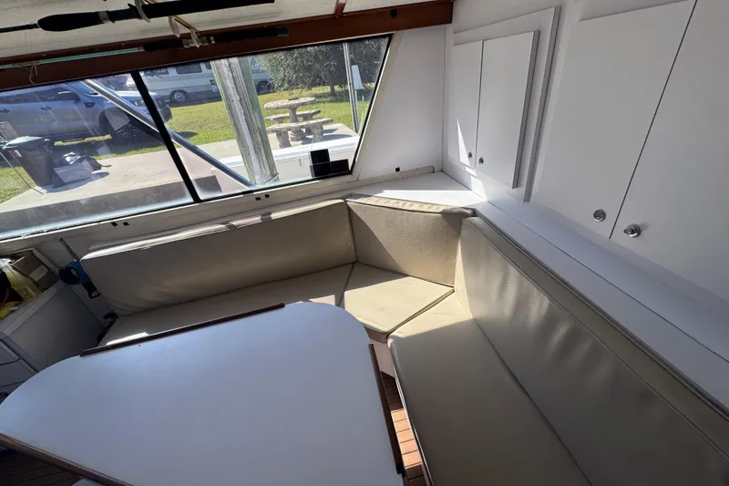 Slide: The Image of Interior of 1965 Hatteras 41 Convertible with beige seating and white cabinetry. - 21