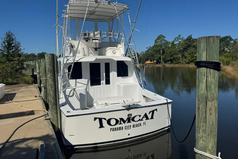 Slide: The Image of 1965 Hatteras 41 Convertible boat docked, named "Tomcat," in Panama City Beach, Florida. - 3