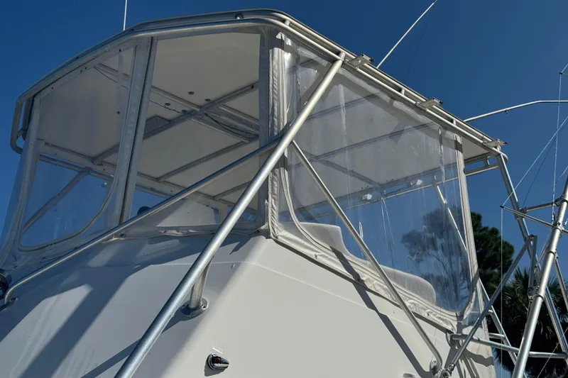 Slide: The Image of 1965 Hatteras 41 Convertible boat with clear enclosure and metal framework. - 9