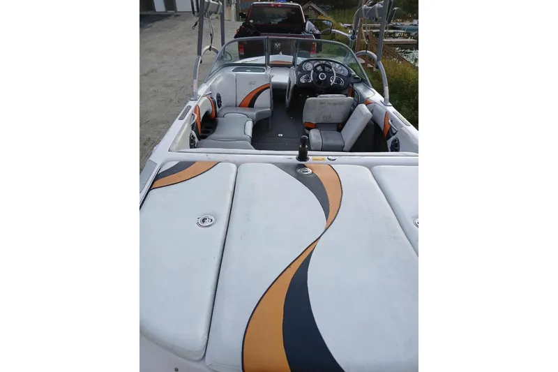 Slide: The Image of 2004 Correct Craft Super Air Nautique boat interior with stylish upholstery design. - 19