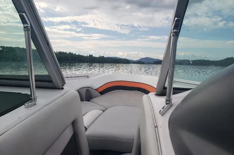 Slide: The Image of 2004 Correct Craft Super Air Nautique boat interior with scenic lake view. - 21