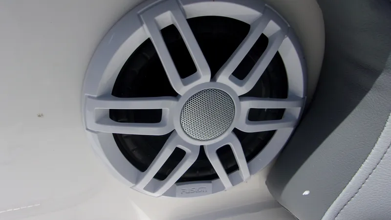 Slide: The Image of Speaker on 2023 NauticStar 203 DC boat, featuring a sleek design. - 10