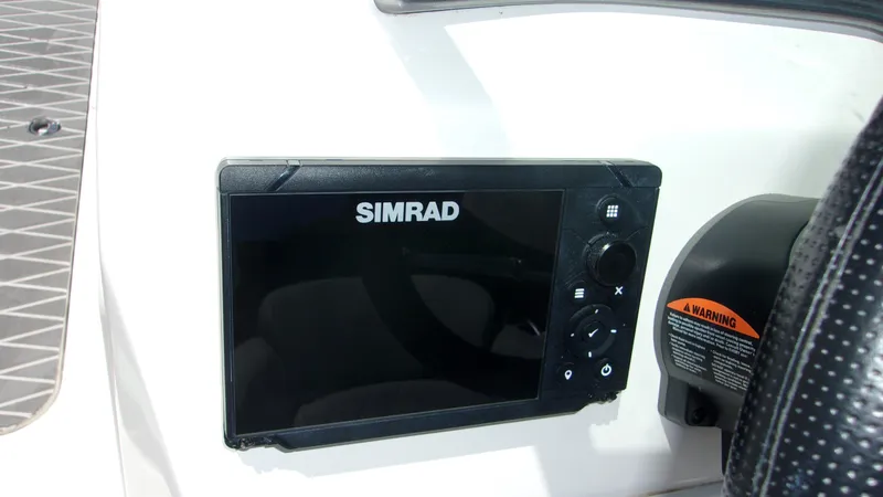 Slide: The Image of Simrad display on 2023 NauticStar 203 DC boat dashboard. - 6