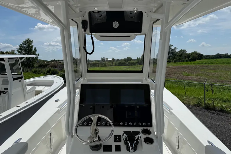Slide: The Image of 2026 Pair Customs 28 Center Console boat interior with speakers and railing. - 12