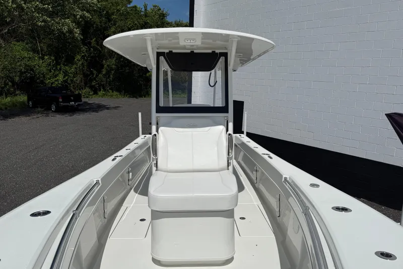 Slide: The Image of 2026 Pair Customs 28 Center Console with dual outboard motors, rear view. - 13