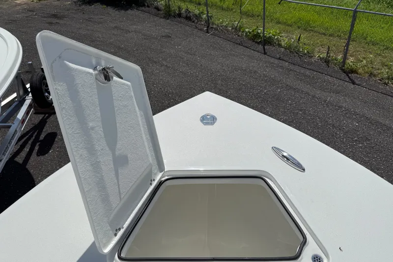 Slide: The Image of 2026 Pair Customs 28 Center Console boat interior with storage compartments and rod holders. - 14