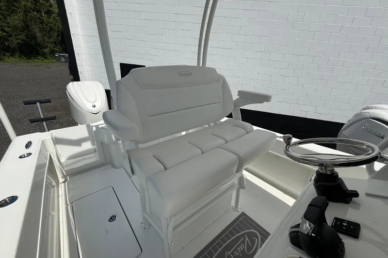 Slide: The Image of 2026 Pair Customs 28 Center Console boat storage compartments with open drawers and cabinets. - 18