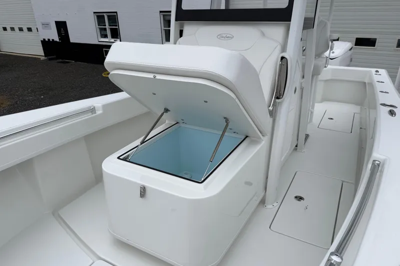 Slide: The Image of 2026 Pair Customs 28 Center Console boat with open storage compartment. - 20