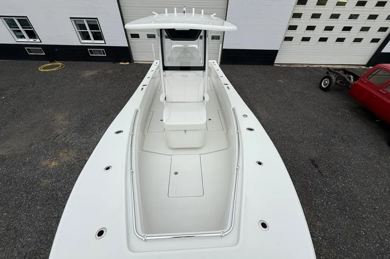 Slide: The Image of 2026 Pair Customs 28 Center Console boat with white seating and sleek design. - 21