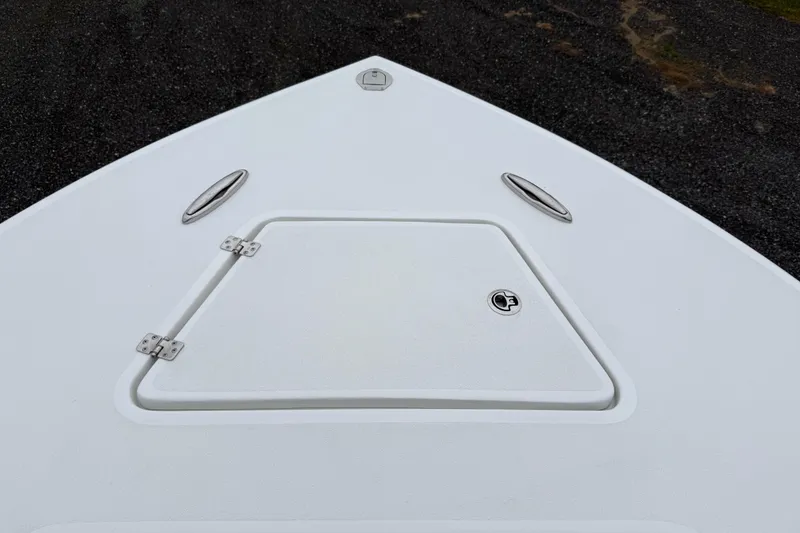 Slide: The Image of 2026 Pair Customs 28 Center Console boat with open storage compartment. - 22