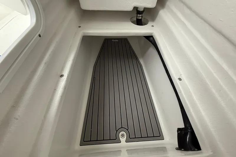 Slide: The Image of 2026 Pair Customs 28 Center Console boat interior with sleek white design and storage compartments. - 29