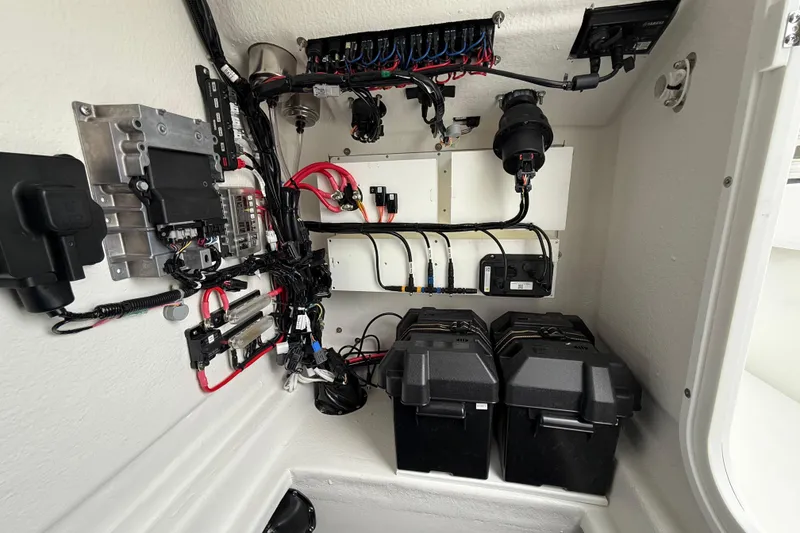 Slide: The Image of 2026 Pair Customs 28 Center Console boat with open storage compartment. - 30