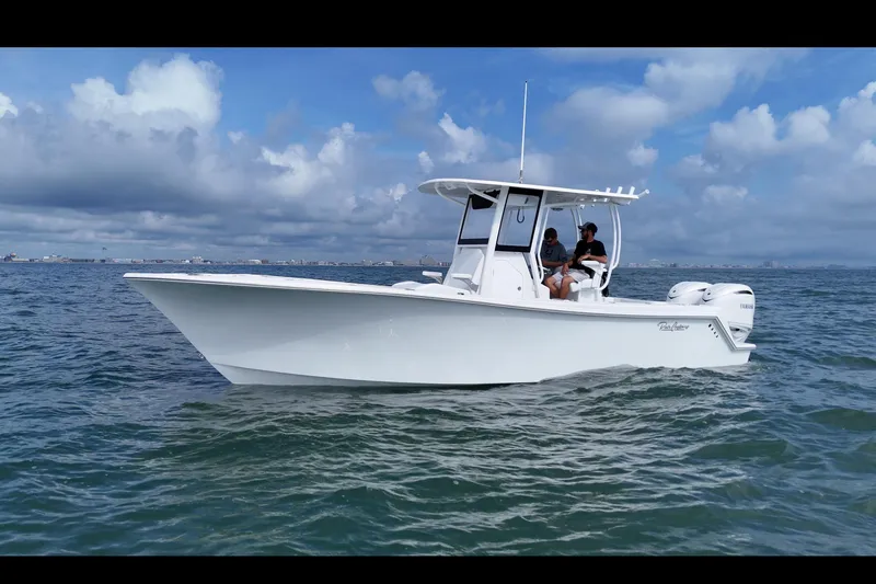 Slide: The Image of 2026 Pair Customs 28 Center Console boat on trailer with Yamaha outboard motor. - 4